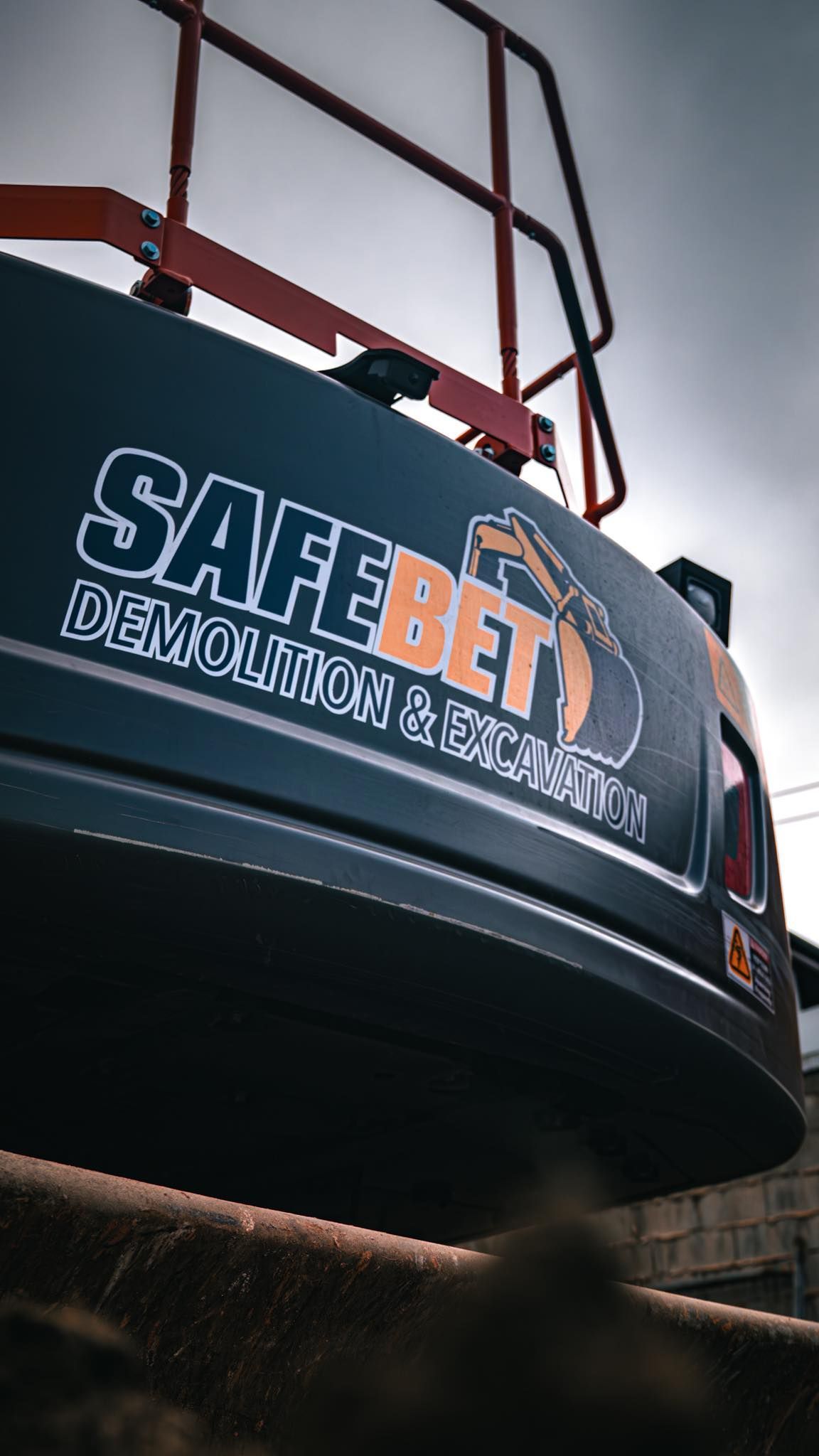 A dark blue excavator with