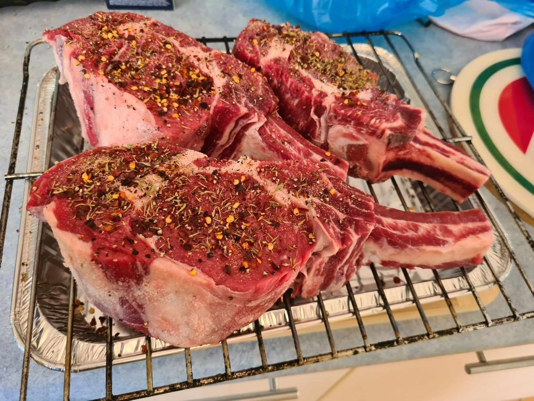 A Bunch of Meat is Sitting on a Wire Rack — Coastal Meats in Yeppoon, QLD