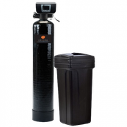 Black water softener tank with control head next to a black brine tank on a white background