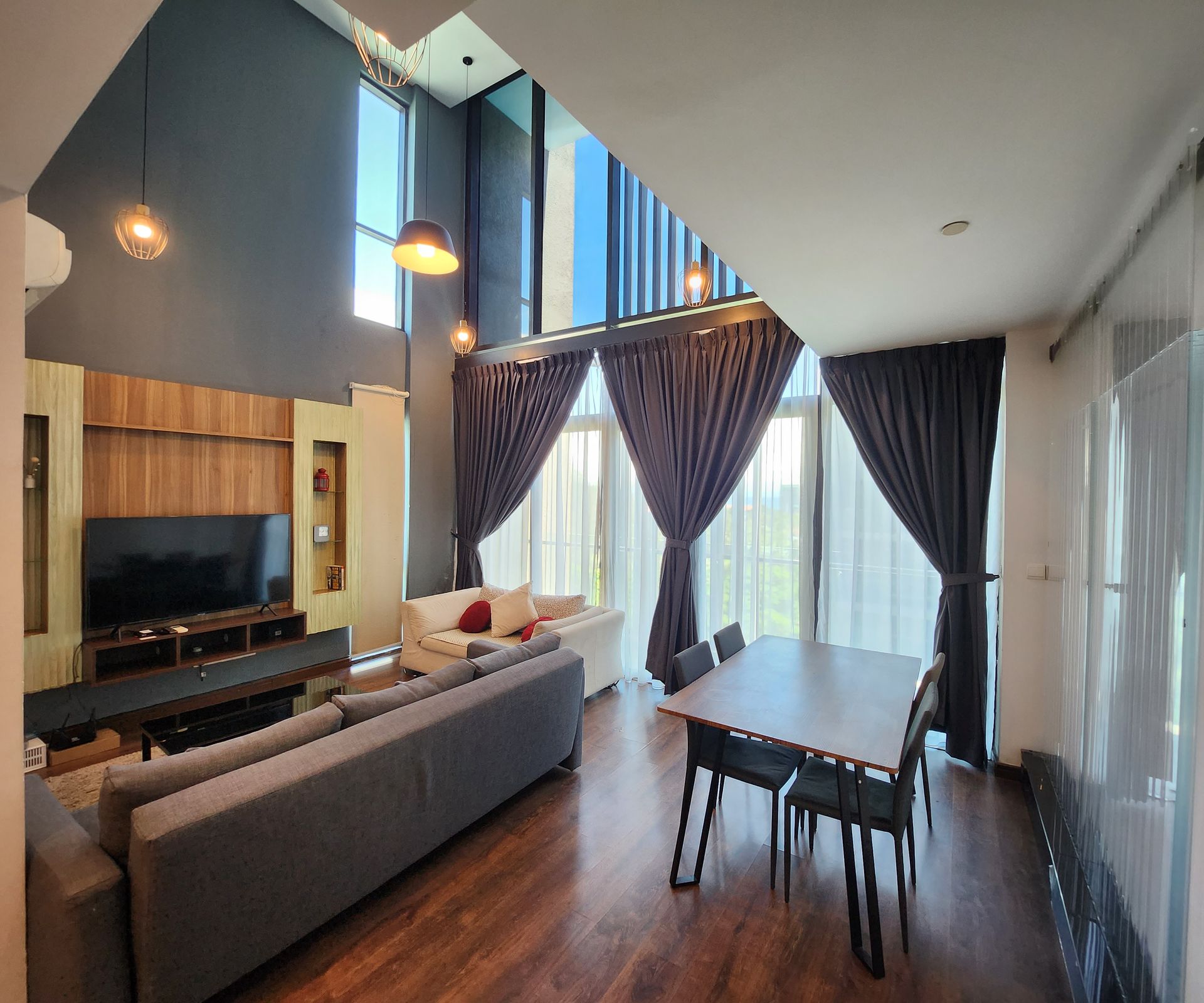 A living room with a couch , table and chairs