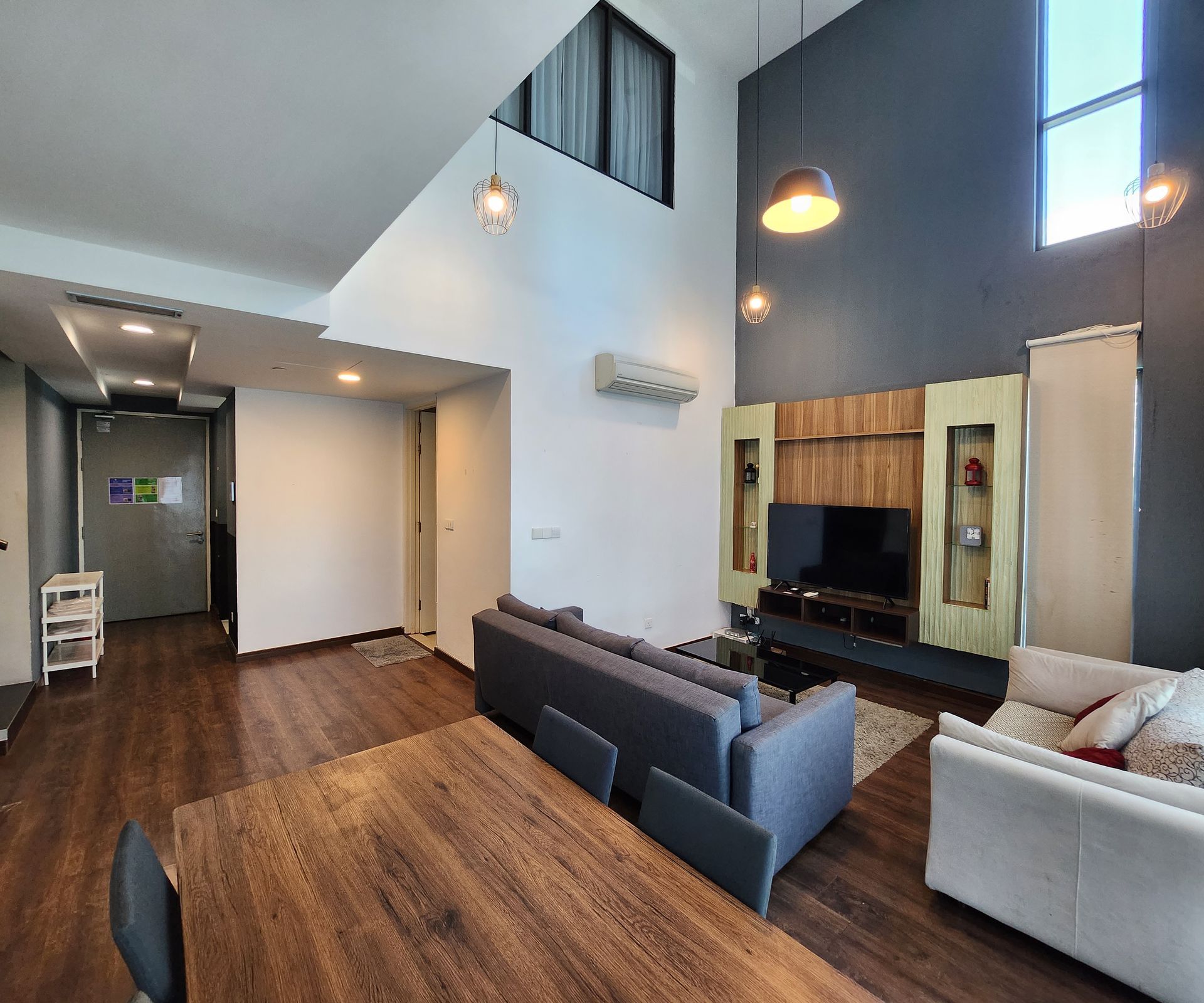 A living room with a couch , table and television