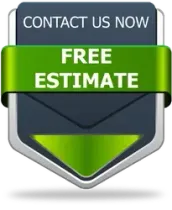A vertical shield-shaped button with a dark gray background, featuring a green horizontal banner that says 