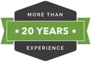 A dark gray hexagon with a green horizontal banner featuring the text 