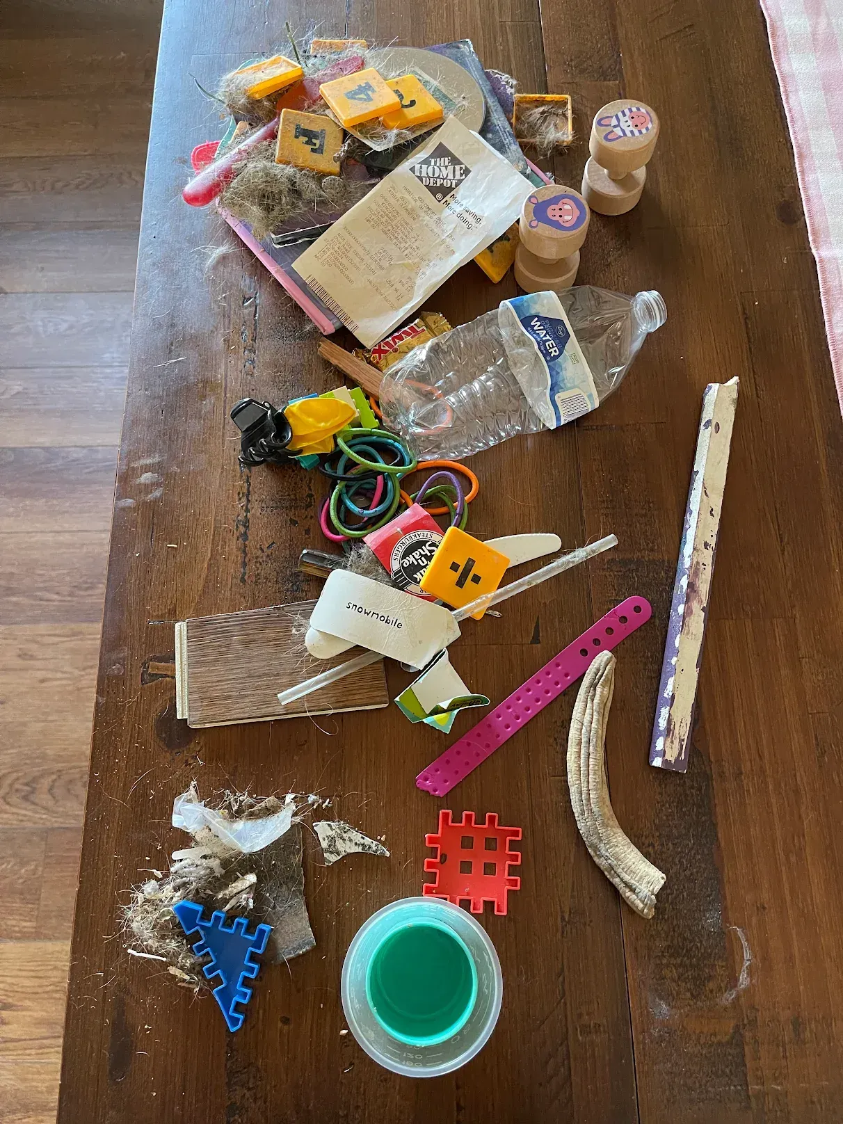 A wooden table with a lot of toys on it