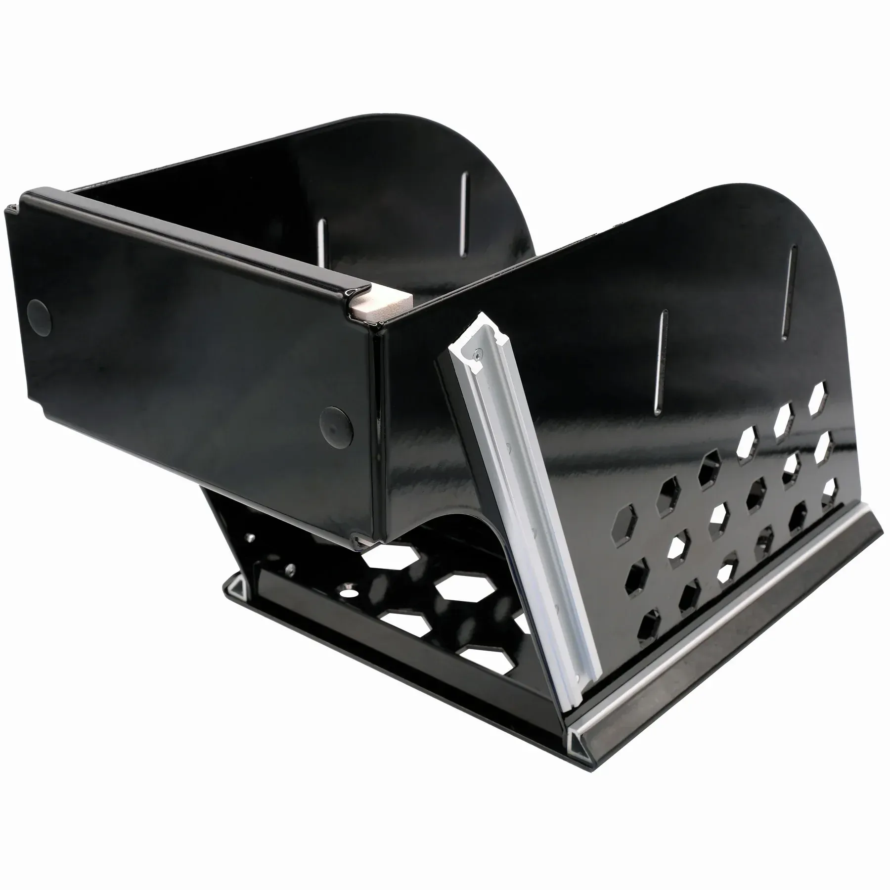 A black metal box with holes in it is sitting on a white surface.