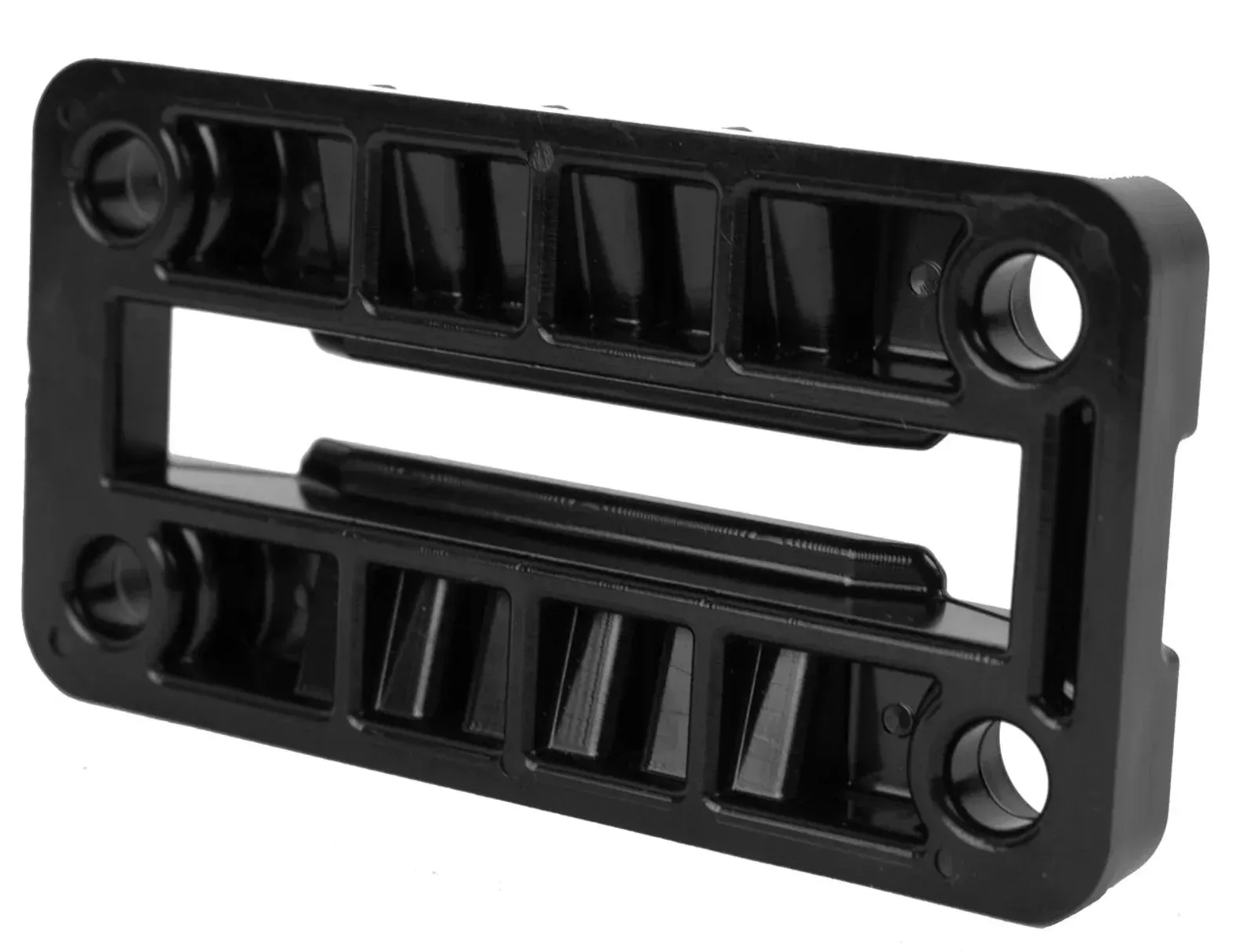 A black plastic item with holes in it on a white background