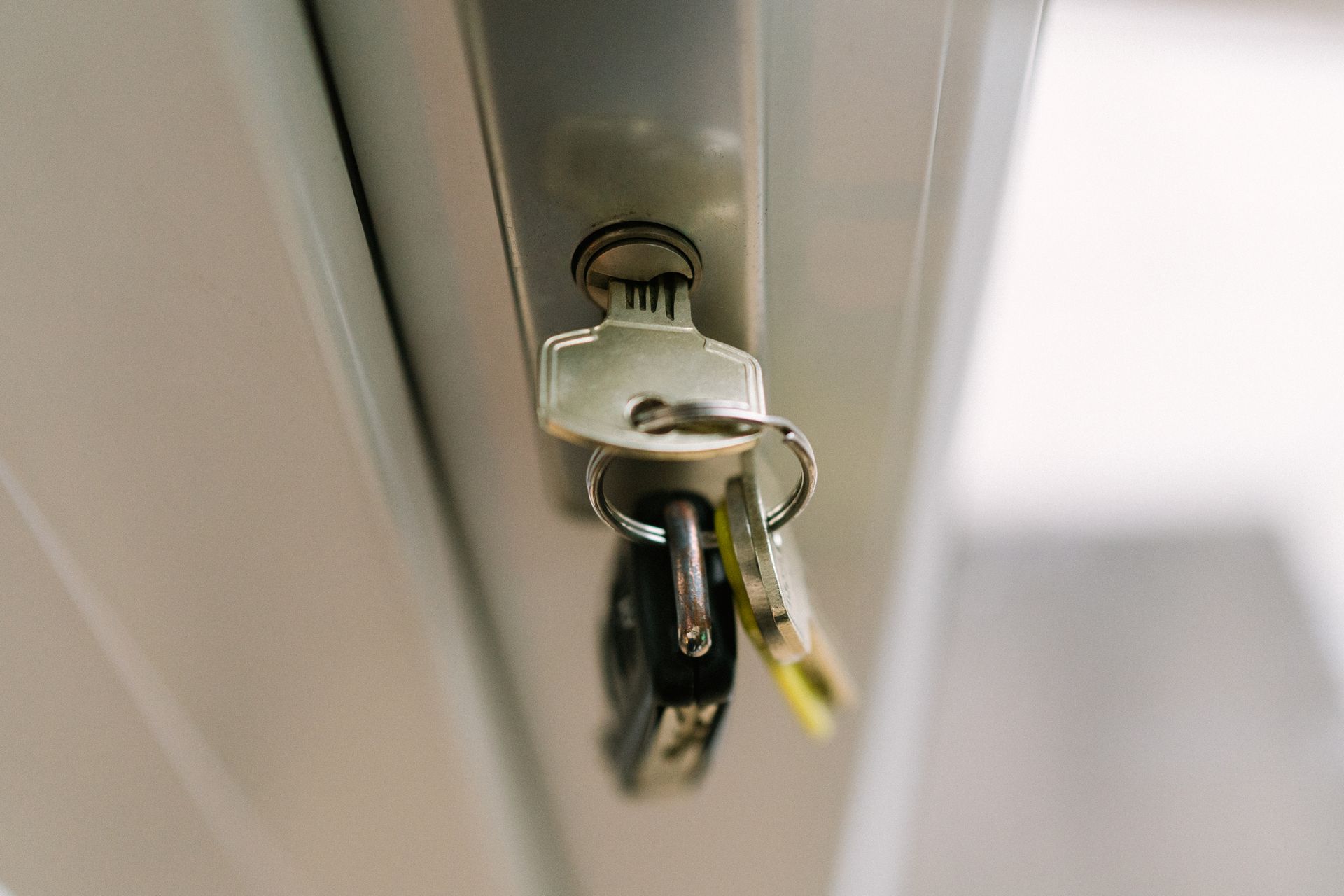 A close up of a key in a door lock.