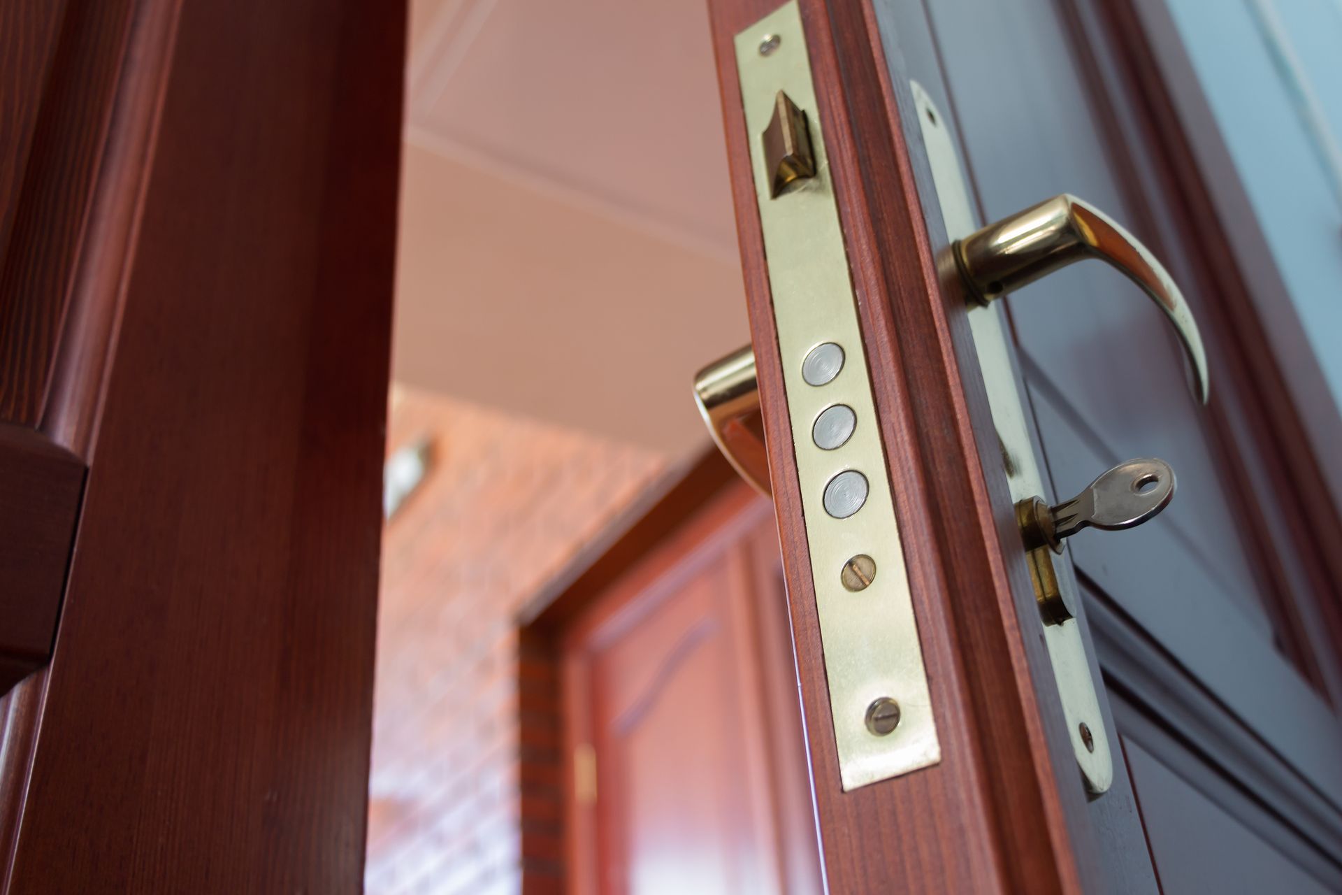 A close up of a door with a key in it.