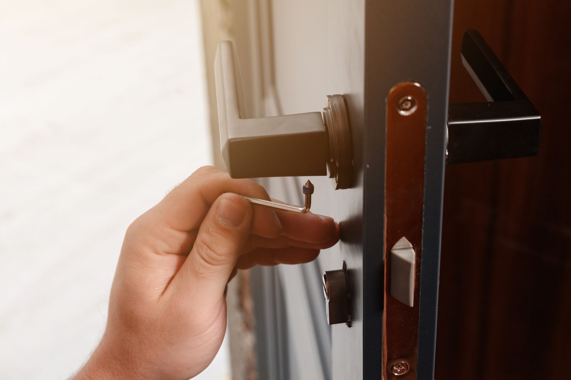 A person is opening a door with a key in it.