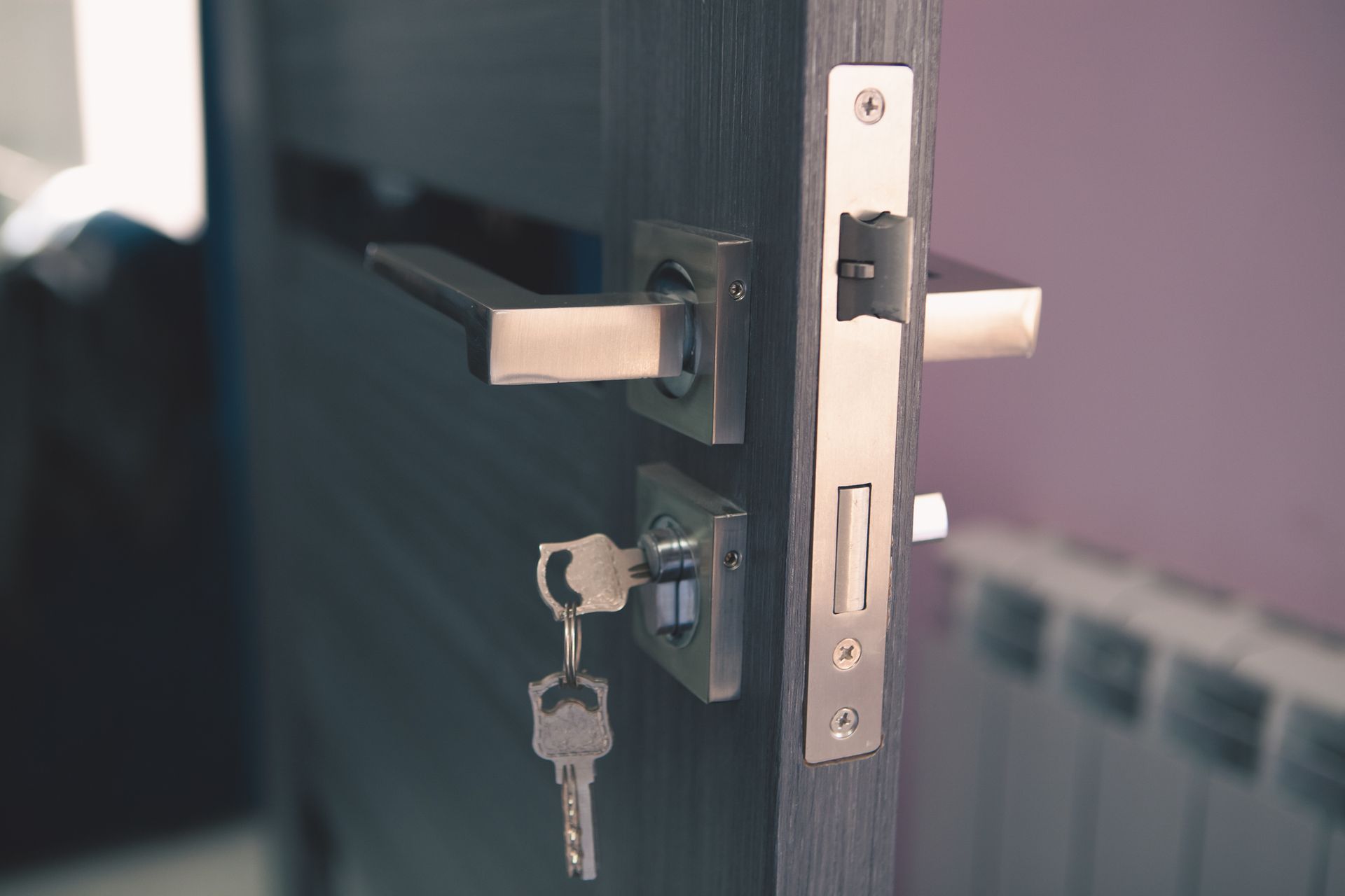 A close up of a door with a key in it.