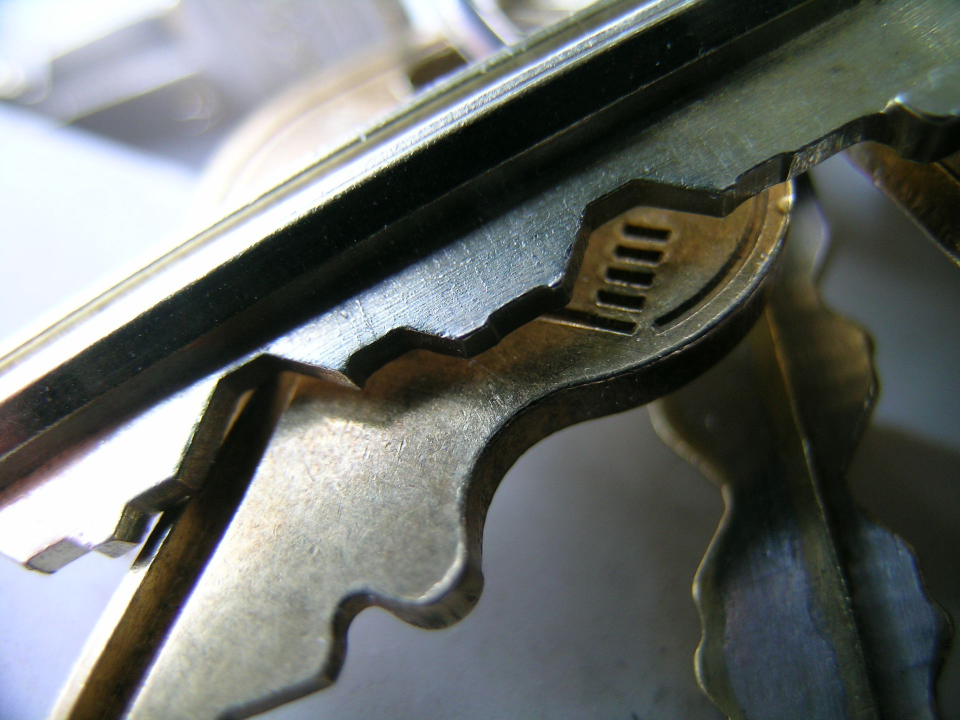 A close up of a key with the letter m on it