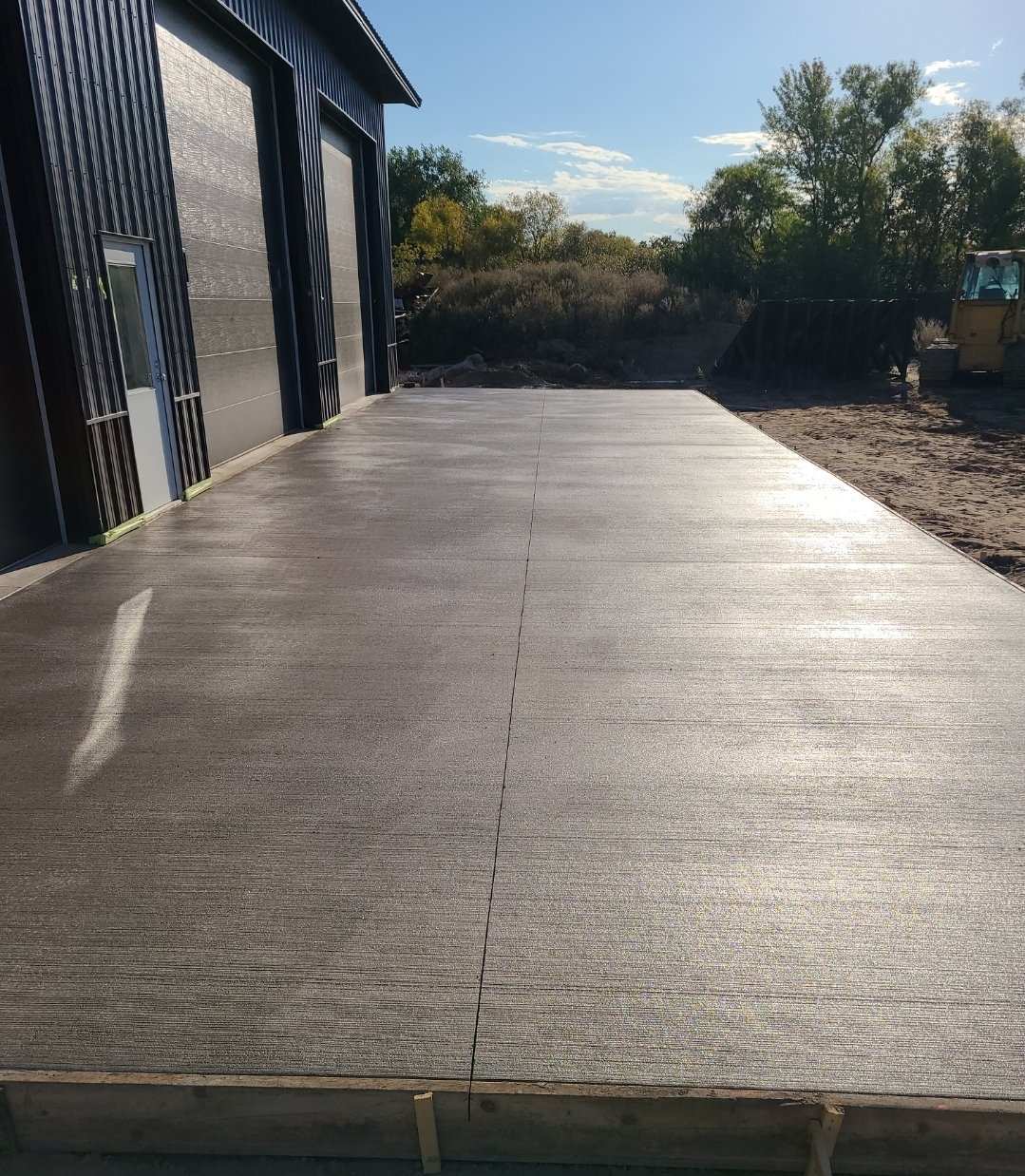 sun shining down on beautiful new concrete. rough cuts construction.