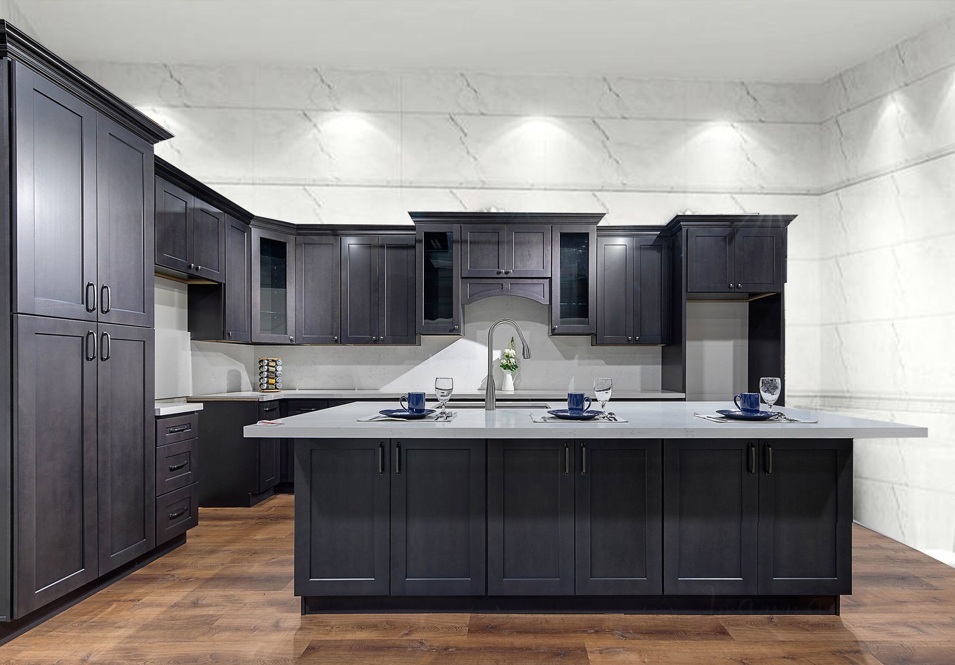 Modern kitchen with dark grey cabinets, island, and light countertop.