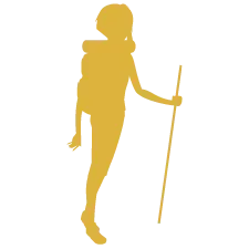 Silhouette of a person with a backpack and a walking stick hiking.