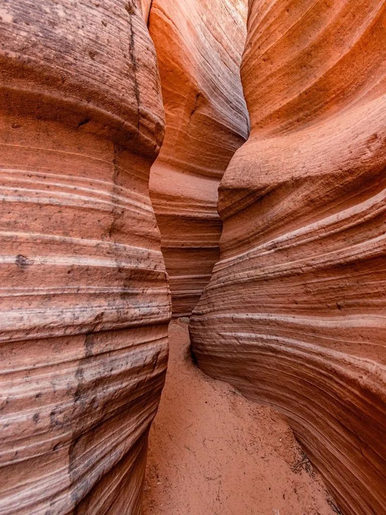A canyon filled with lots of rocks and sand.