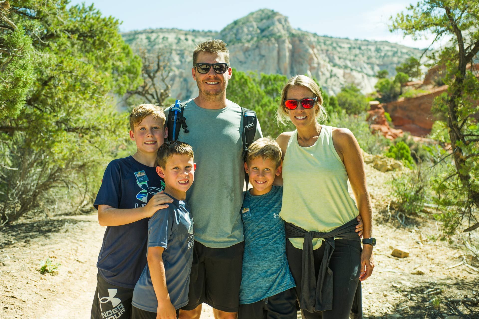 Happy family smiling at the mountain