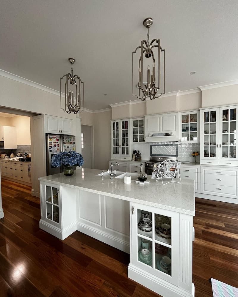 A Large Kitchen With White Cabinets — Lake Macquarie Designer Kitchens In Wangi Wangi, NSW