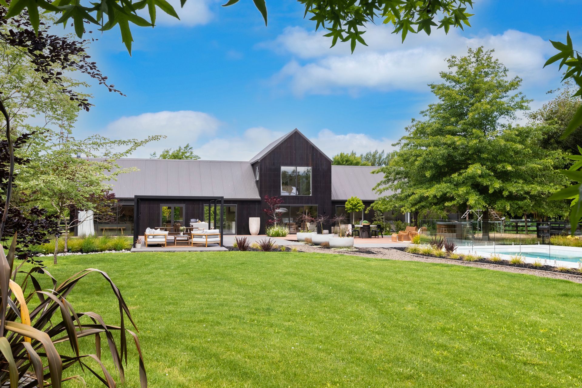 A large house with a large lawn in front of it