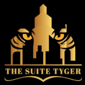 Gold tiger logo with stylized face and text “THE SUITE TYGER” on black background