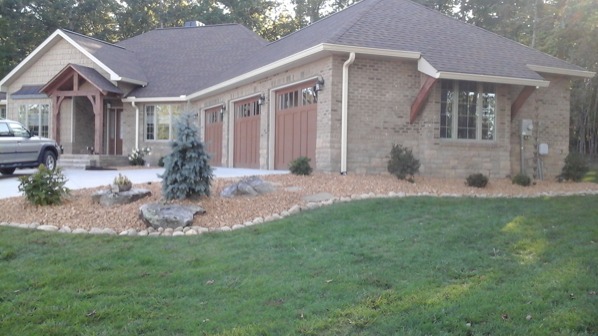A house with a car parked in front of it