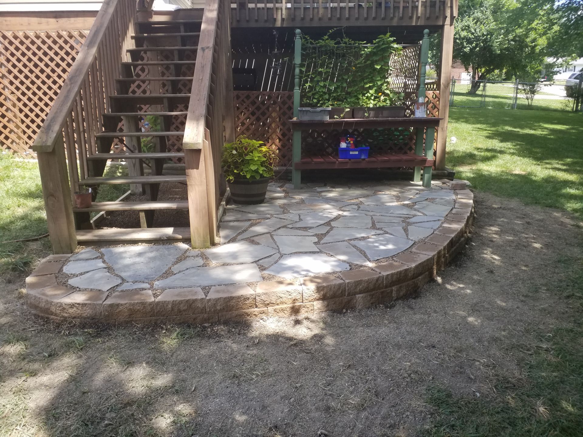 A wooden deck with stairs leading up to it