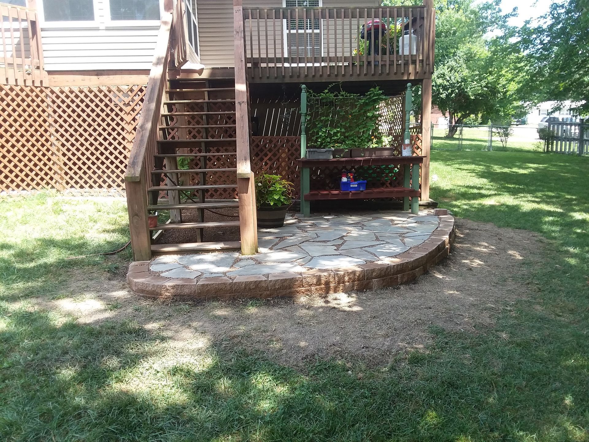 A wooden deck with stairs leading up to it
