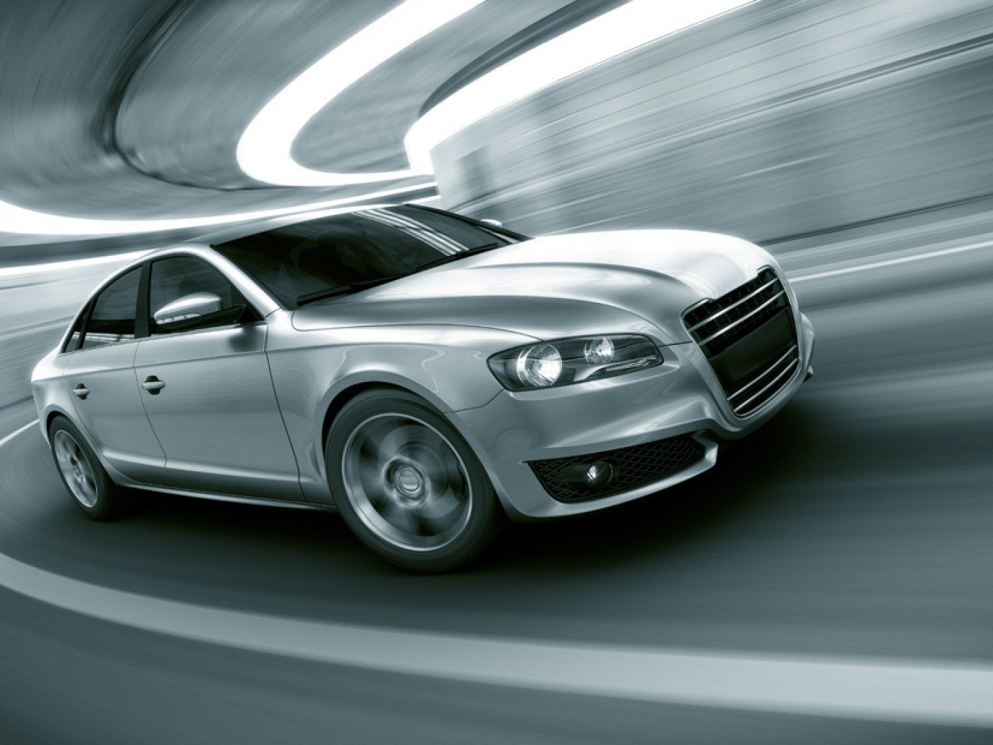 A high-end automobile is driving down the road