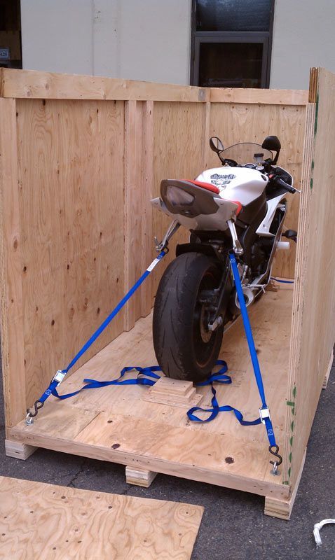 A Motorcycle is Sitting in a Wooden Box with Blue Straps | San Rafael, CA | Earl Farnsworth Express