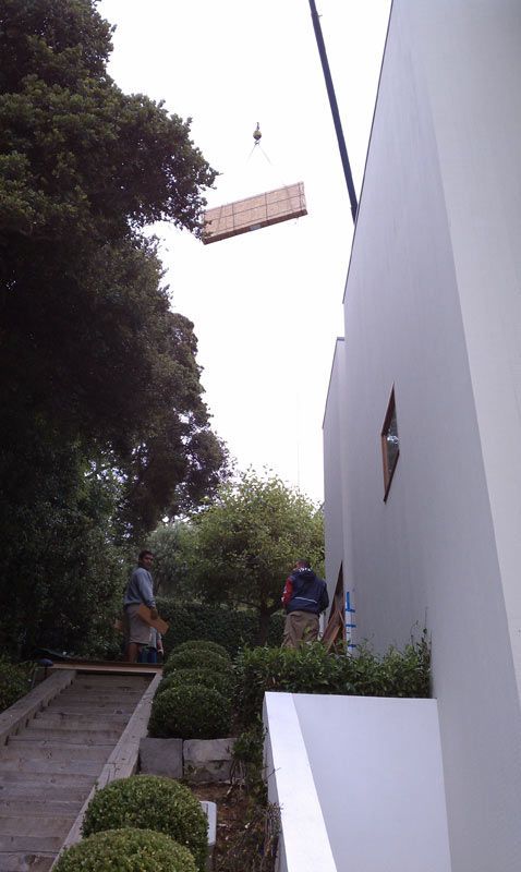A Large Piece of Wood is Being Lifted into the Air by a Crane | San Rafael, CA | Earl Farnsworth Express