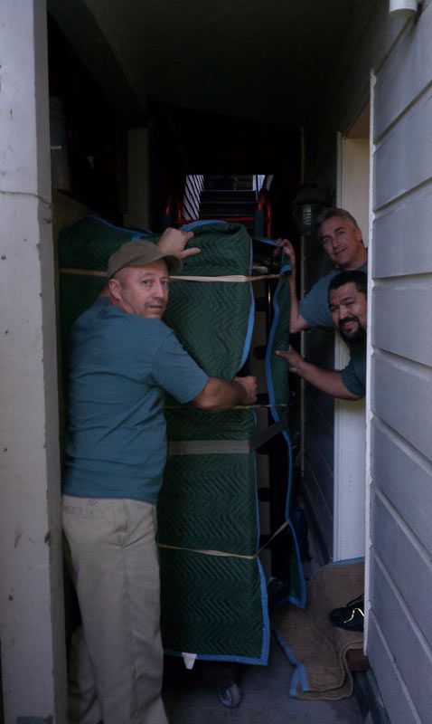 A Group of Men are Moving a Piano into a House | San Rafael, CA | Earl Farnsworth Express