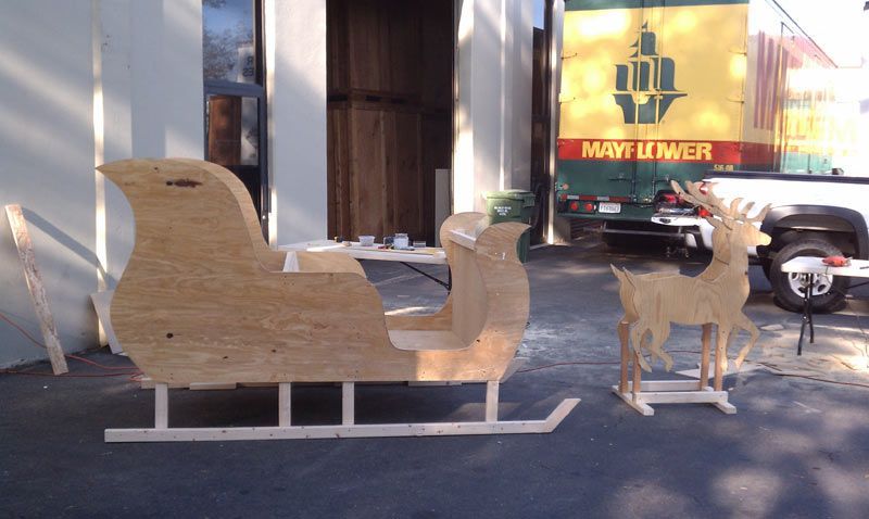 A Sleigh and Two Deer are Sitting in front of a May Luner Truck | San Rafael, CA | Earl Farnsworth Express
