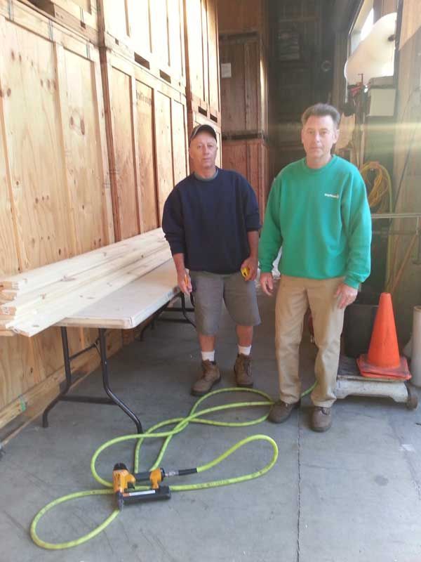 Two Men Standing next to a Table with a Hose Attached to it | San Rafael, CA | Earl Farnsworth Express