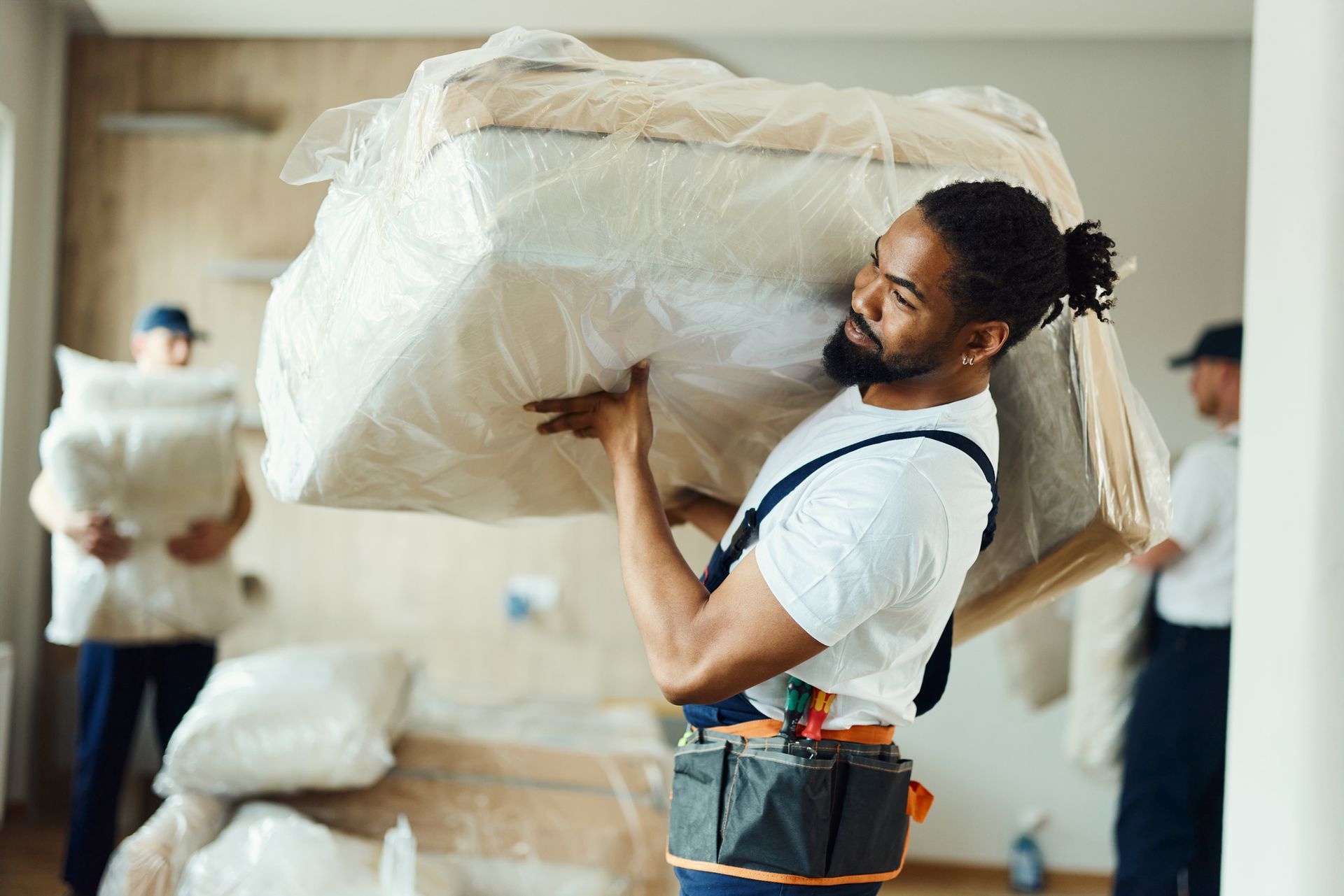 A man is carrying furniture.