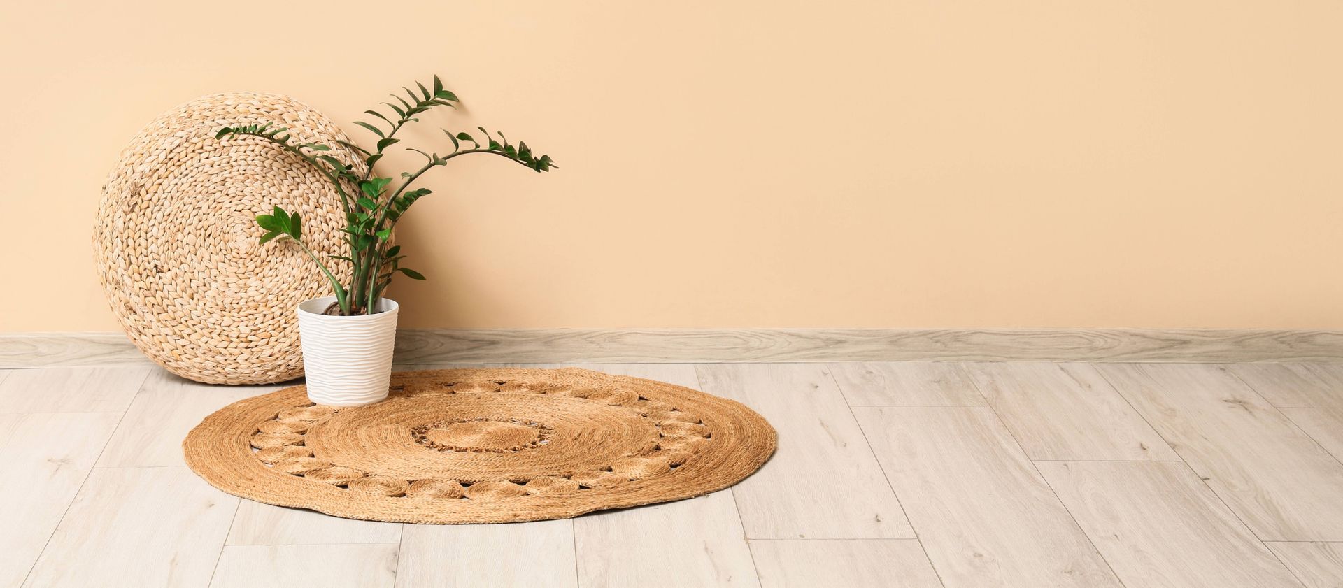 Indoor plant with woven mat on affordable LVP floor near Myrtle Beach