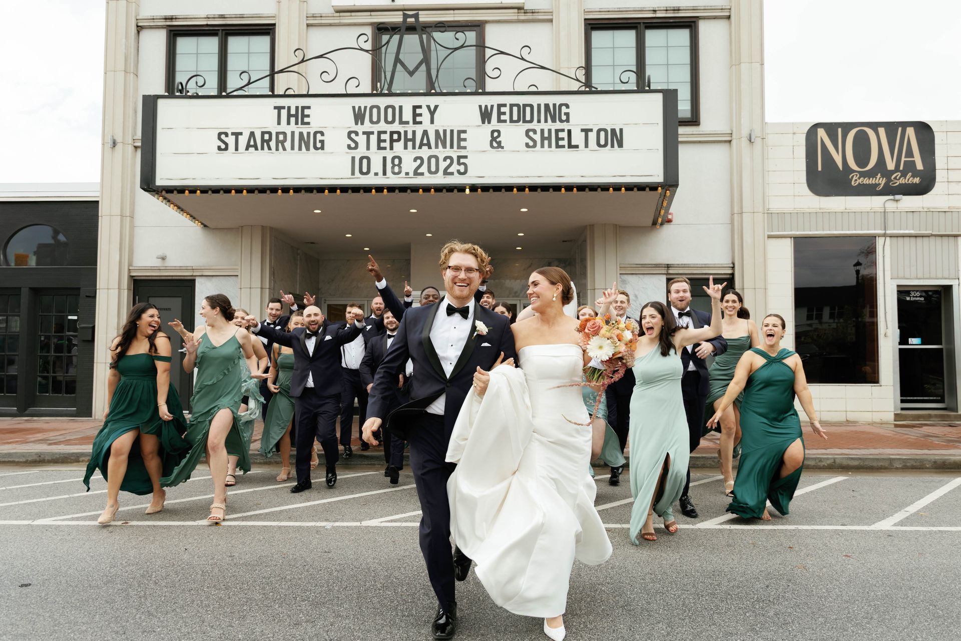 Newlyweds, Stephanie & Shelton, celebrate their wedding with a group exiting the theater. Building marquee reads 