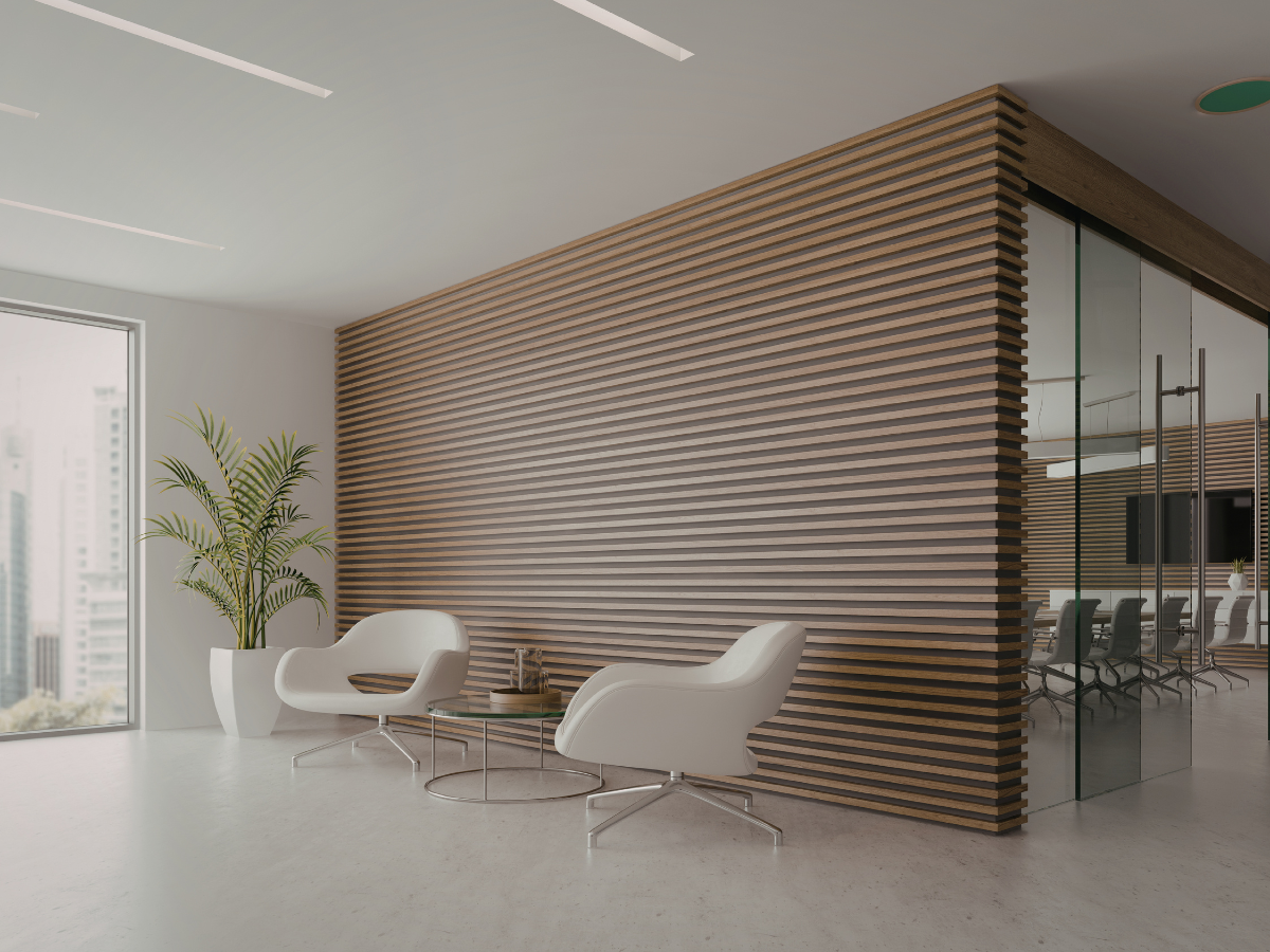 Modern office waiting area with two white chairs, wooden wall, and glass-walled conference room.
