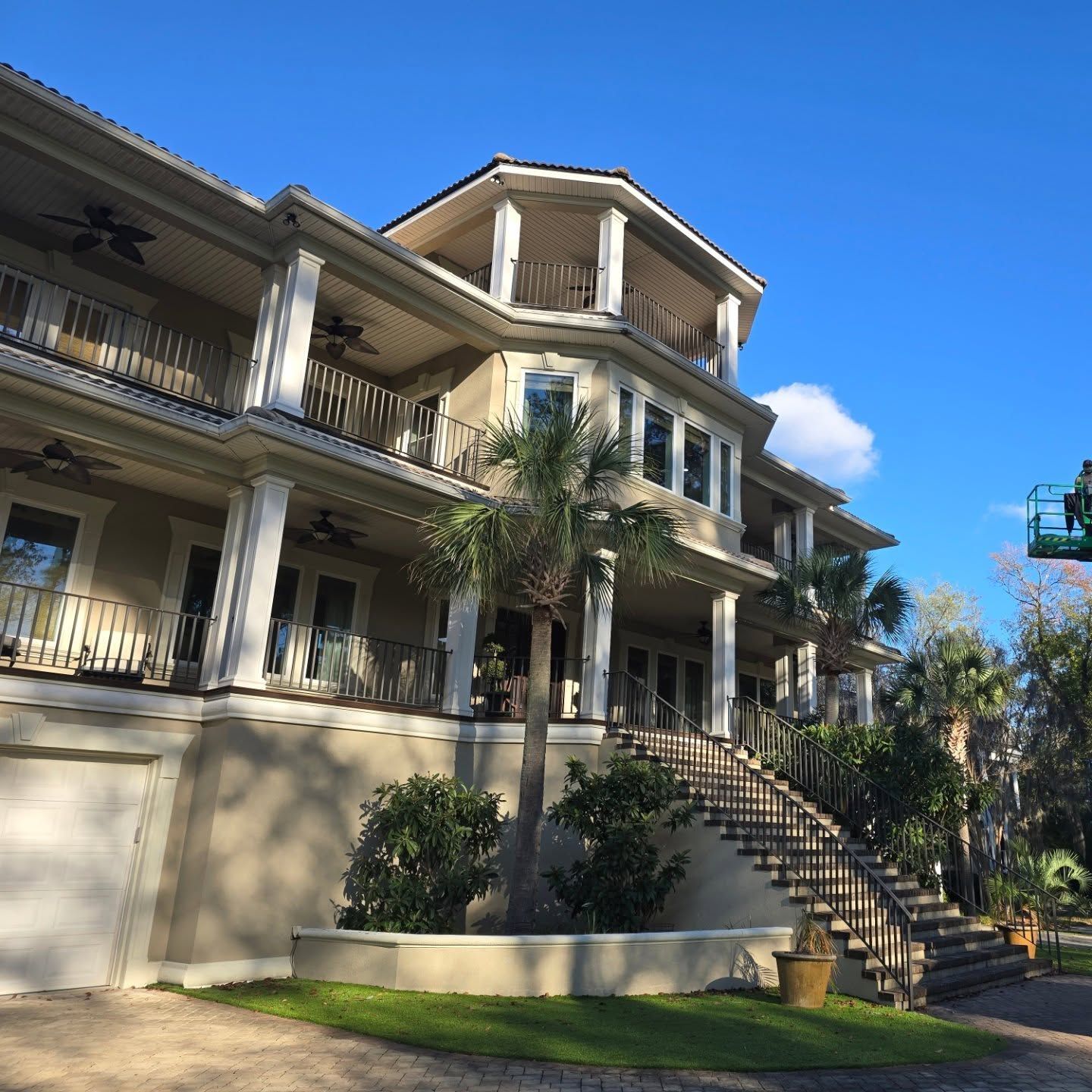 A large house with stairs leading up to it