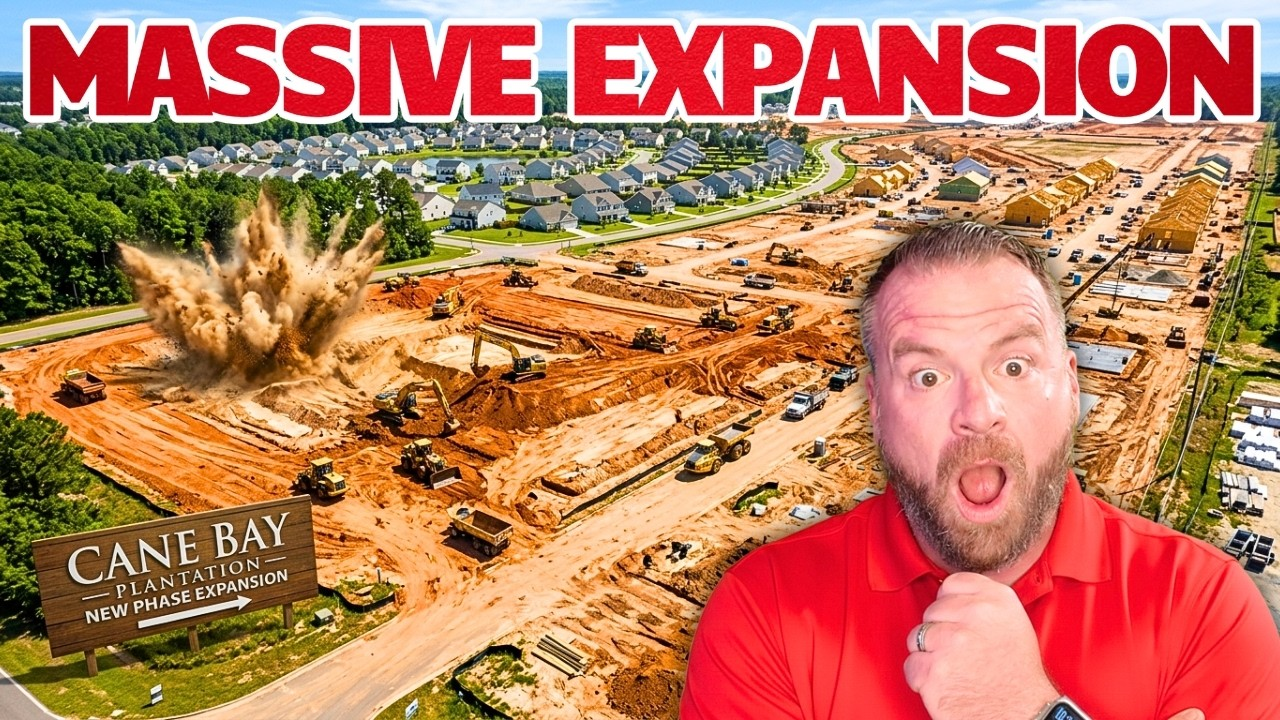 Construction site with bold “MASSIVE EXPANSION” text and a surprised man in a red shirt in the foreground