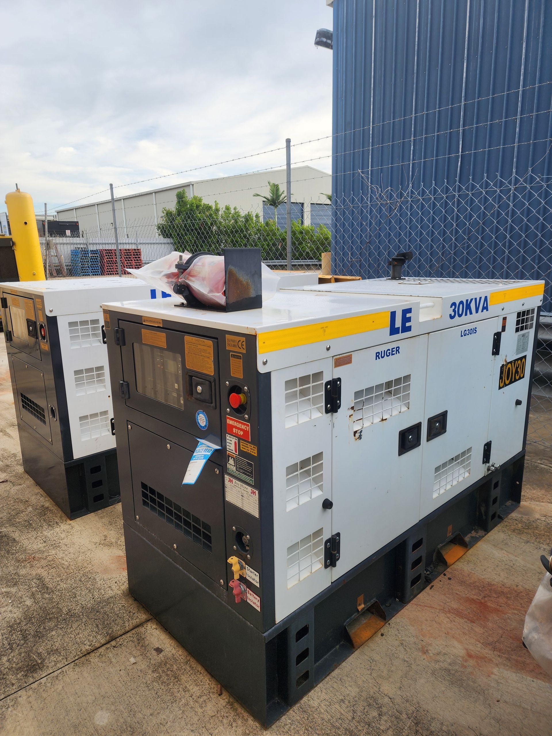 Generators Under a Roofed Shelter. Gray and Black, Outdoors — Joy Hire Compressor Hire & Maintenance in Paget, QLD