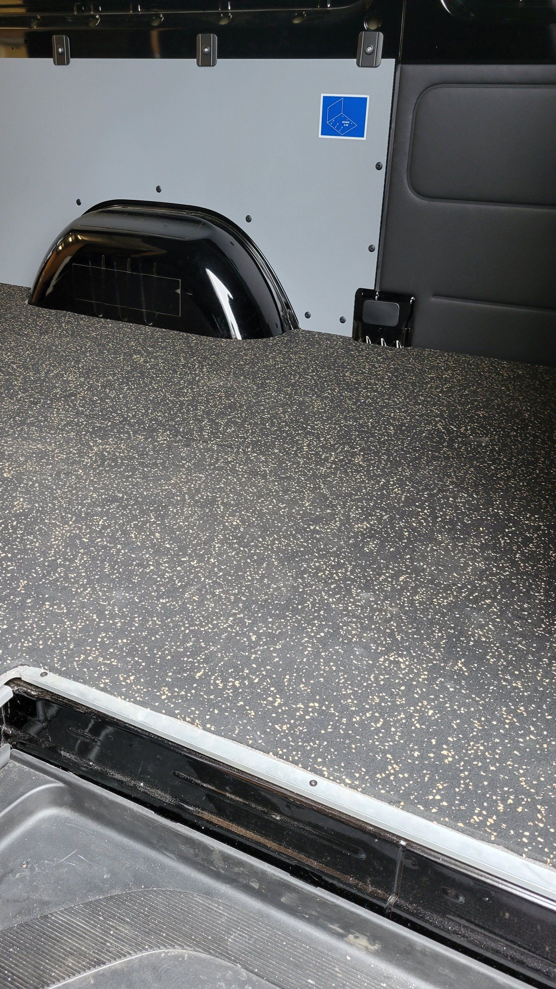 A close up of the floor of a van with a handicap sticker on it.