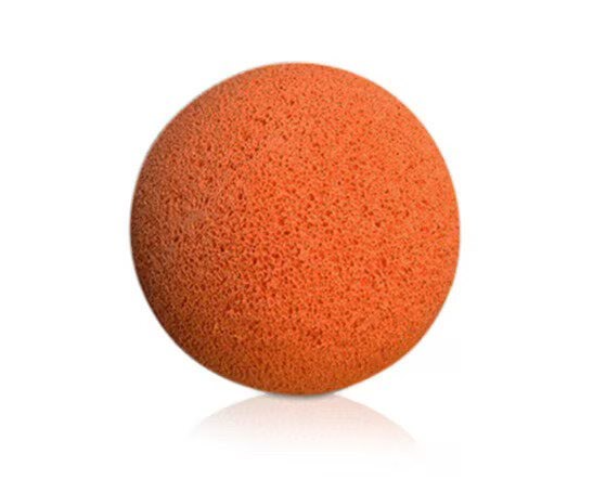 A close up of an orange ball on a white background