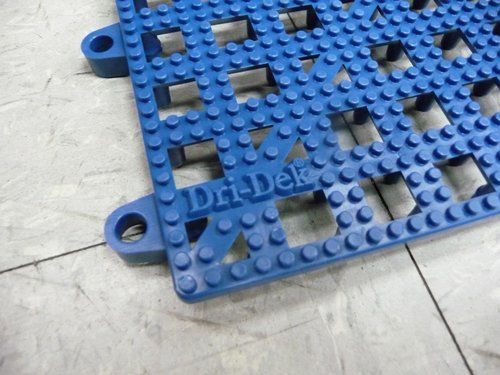 A blue plastic mat with the word dri-dek on it