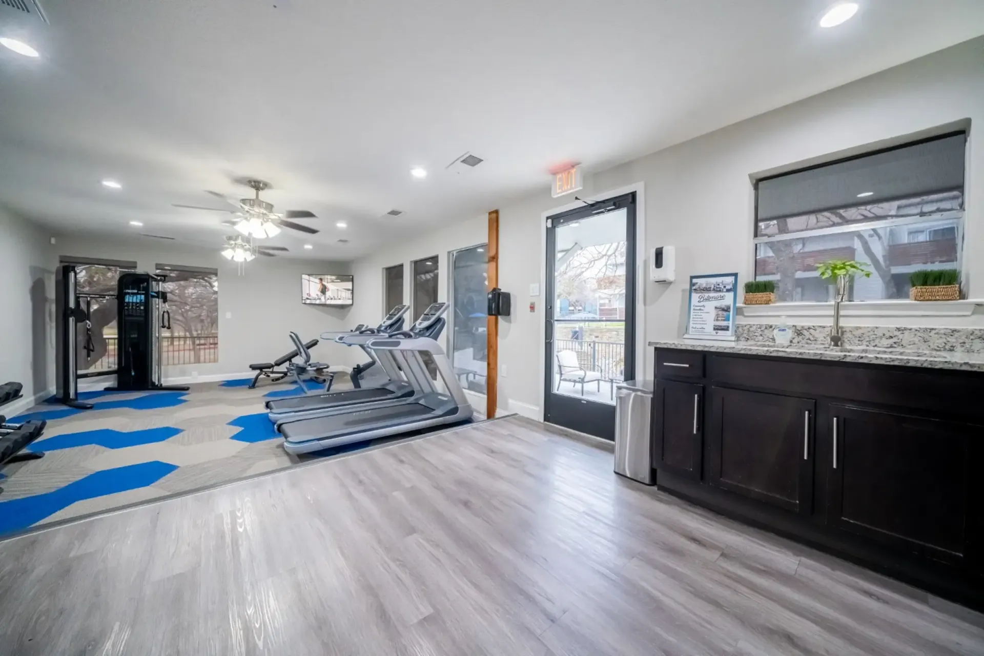There is a treadmill in the middle of the room.