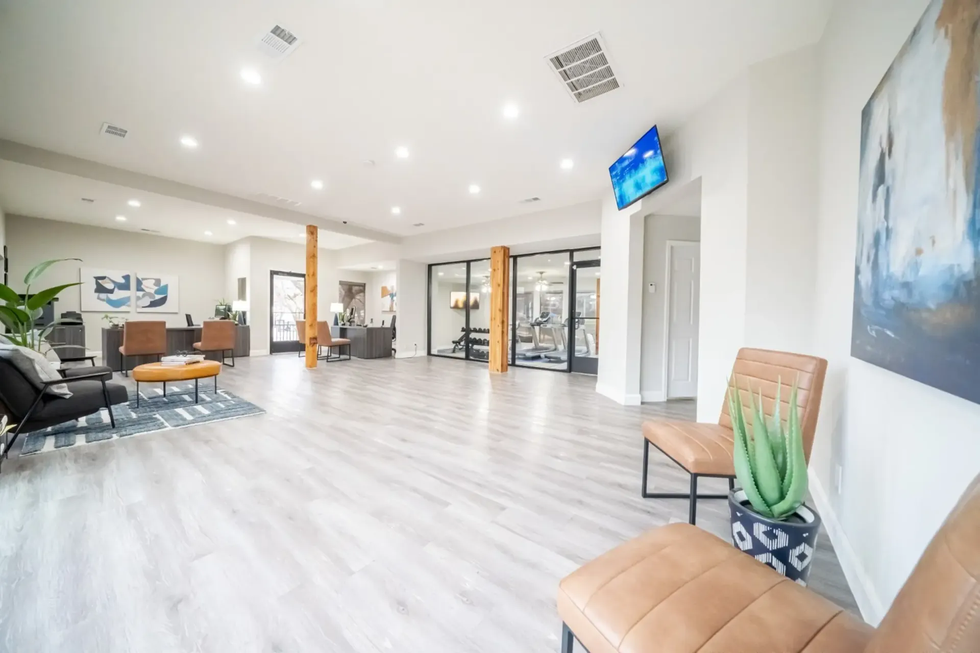 A large room with a lot of furniture and chairs in it.