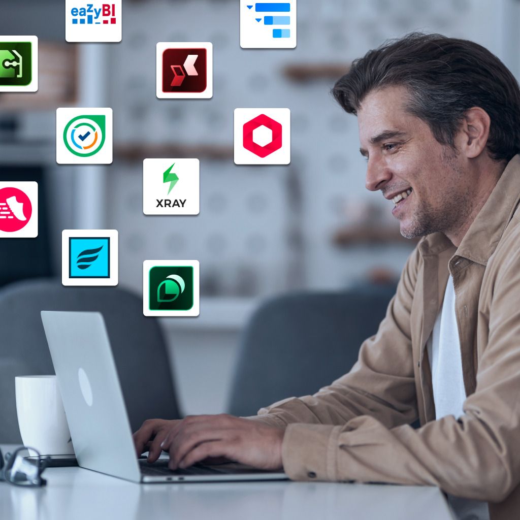 Man working on a laptop, smiling, with app icons floating in the background.
