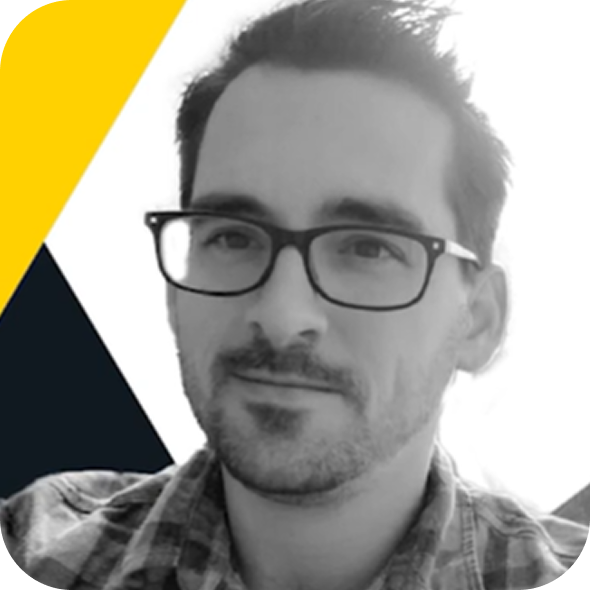 Portrait of a man wearing glasses against a black, white, and yellow geometric background