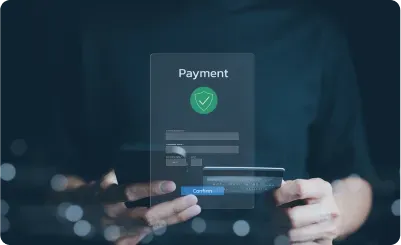 Person holding credit card and phone with payment confirmation interface, a digital transaction.