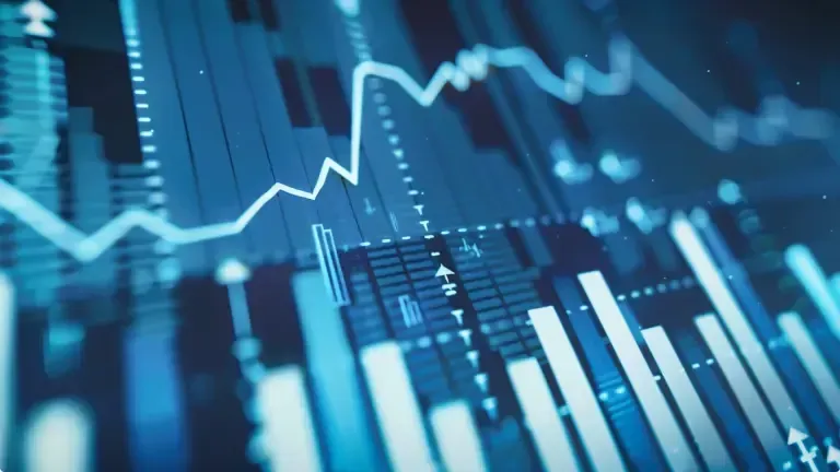 Line and bar graphs showing fluctuating financial data in shades of blue.