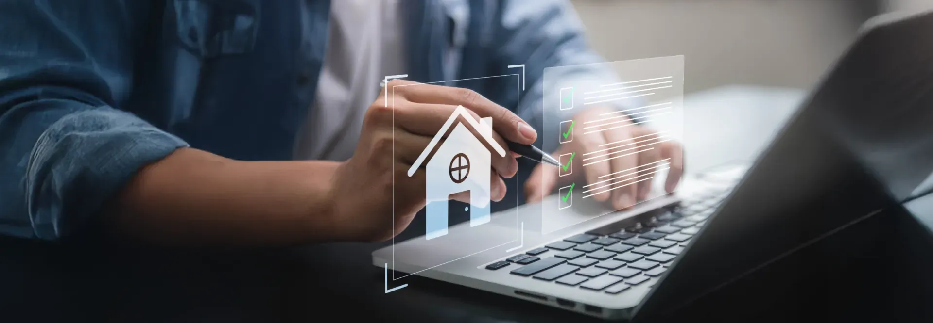 Person using a laptop with a digital house icon overlaid, possibly related to real estate or property.