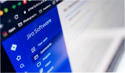 Jira Software interface displayed on a computer screen, with a blue sidebar and menu options, including